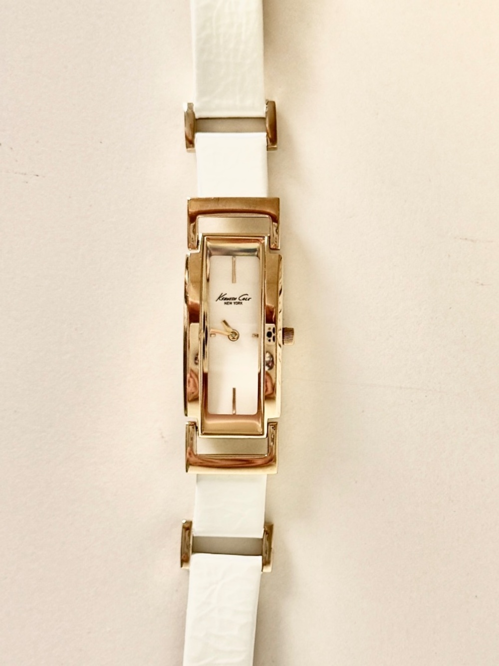 Kenneth Cole NY skinny tank watch white leather band gold face chain and buckle